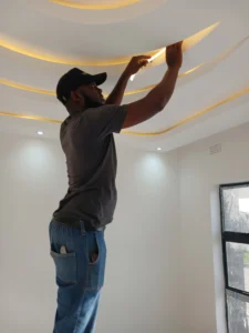 teralux-man-installing.architectural-premium-lights